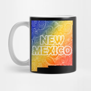 Colorful mandala art map of New Mexico with text in blue, yellow, and red Mug